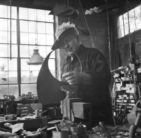 Calder working on the pierced disc of Bougainvillier, Roxbury studio (1947)