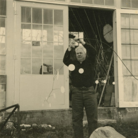 Calder assembling Laocoön outside of his Roxbury studio (1947)