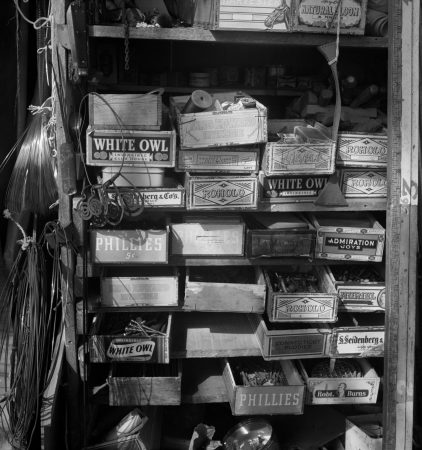 Calder’s storage shelves with necklace in his Roxbury studio (1950)
