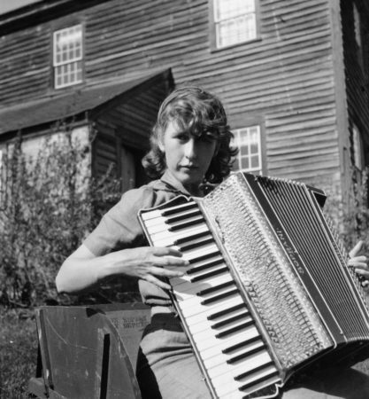 Louisa Calder playing accordion (1938)