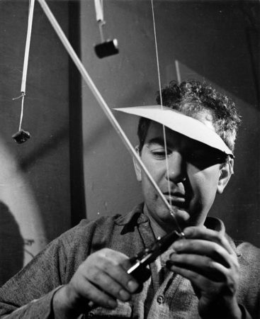 Calder working on Swizzle Sticks (1936)